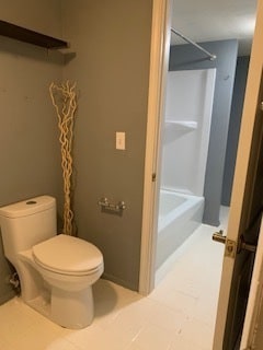 bathroom with tile patterned flooring and toilet