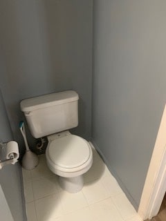 bathroom featuring toilet and tile patterned floors