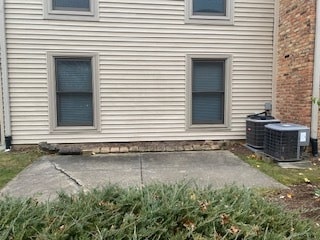 view of property exterior featuring a patio area and central air condition unit