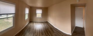 spare room featuring dark hardwood / wood-style flooring