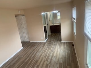 spare room with dark wood-type flooring