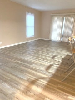 spare room featuring hardwood / wood-style flooring