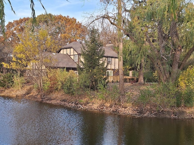 rear view of property with a lawn and a wooden deck