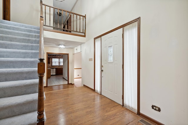 unfurnished living room featuring carpet floors and a brick fireplace