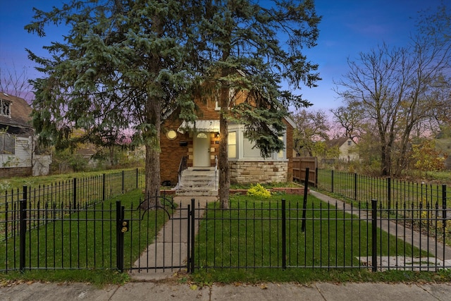 view of front of house with a lawn