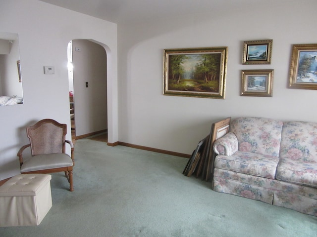 living area featuring light colored carpet