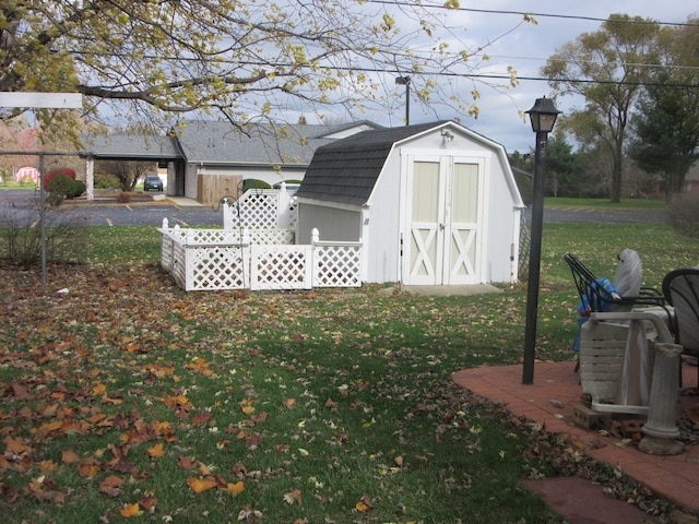 view of outdoor structure with a lawn