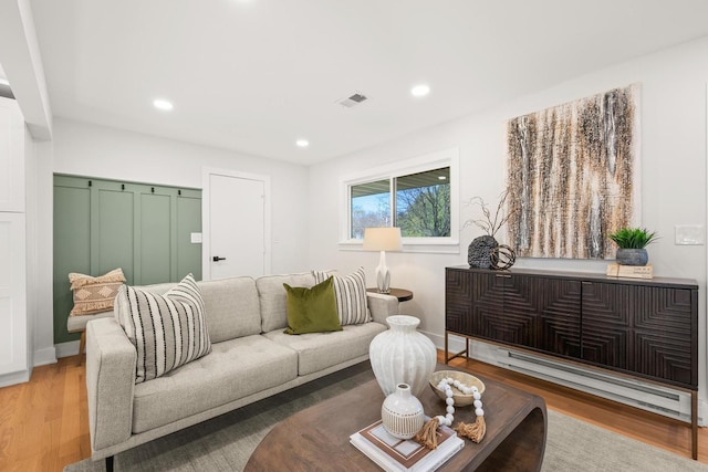 living room with light hardwood / wood-style flooring