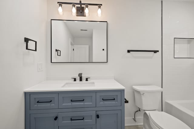 bathroom with vanity and toilet