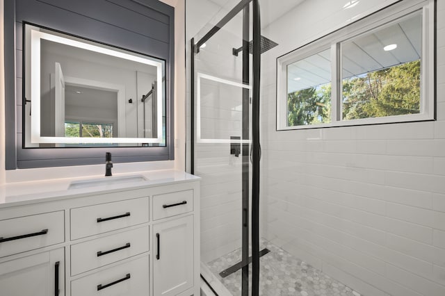 bathroom with vanity and walk in shower