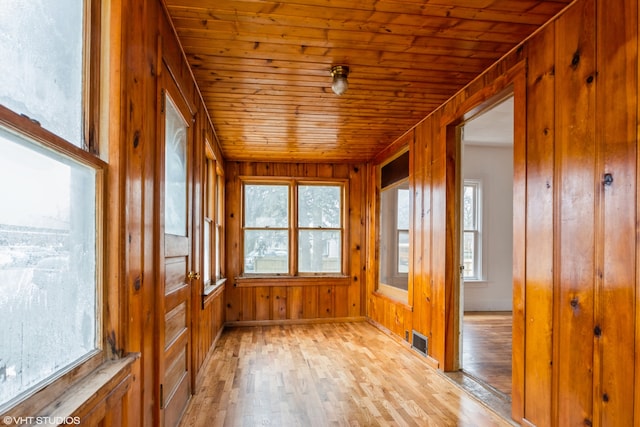 unfurnished sunroom featuring wood ceiling