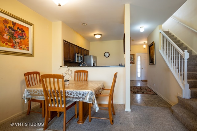 view of carpeted dining area