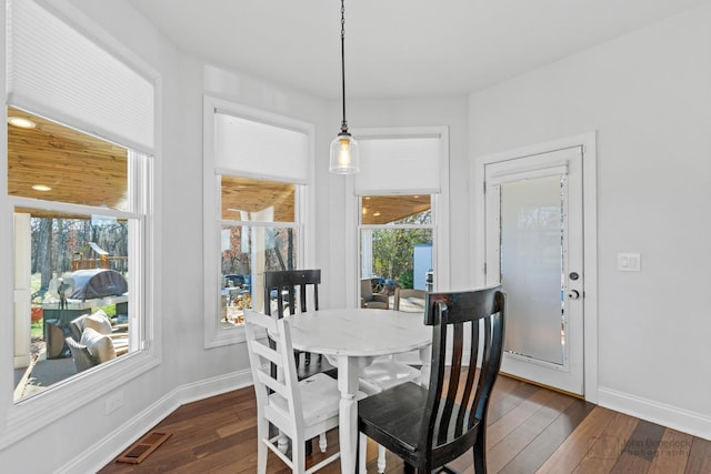 dining area featuring dark hardwood / wood-style floors