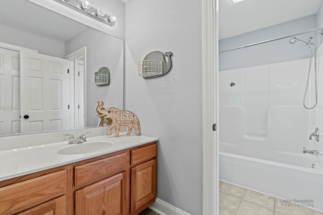 bathroom with tile patterned flooring, vanity, and shower / washtub combination