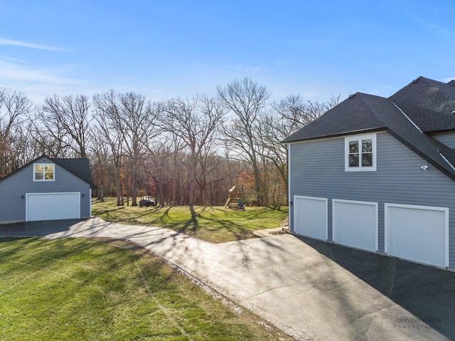 view of home's exterior featuring a yard and a garage