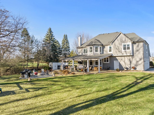 back of property featuring a lawn and a patio area