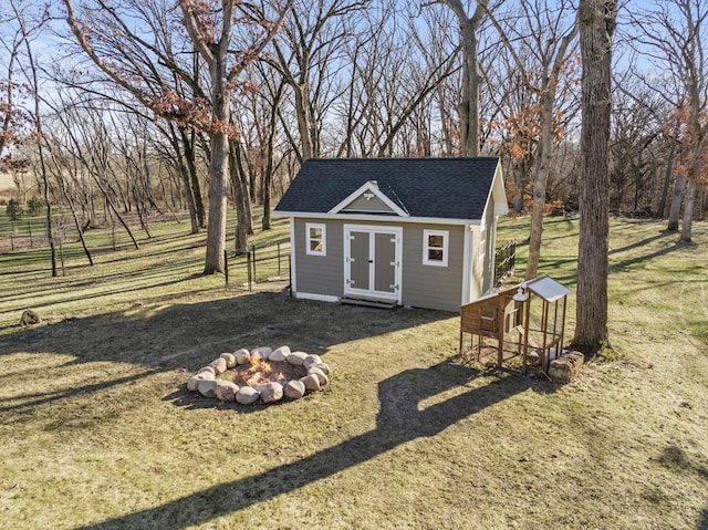 view of outdoor structure featuring a yard and a rural view