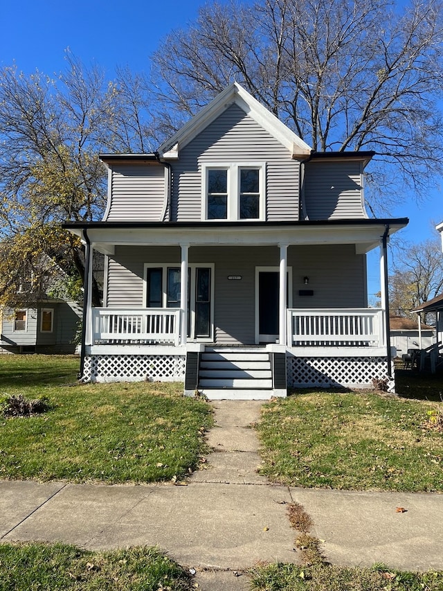 view of front of property featuring a porch and a front yard