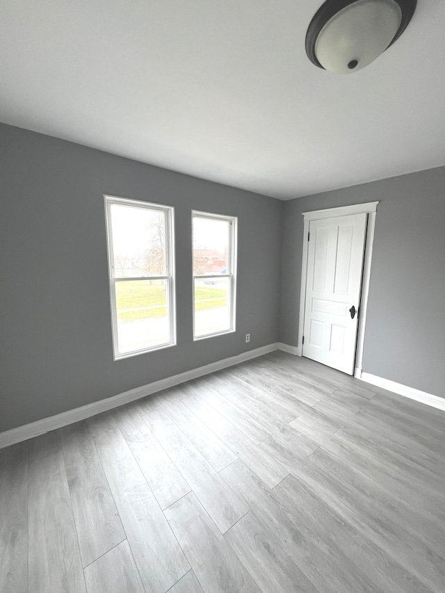 unfurnished room featuring light wood-type flooring