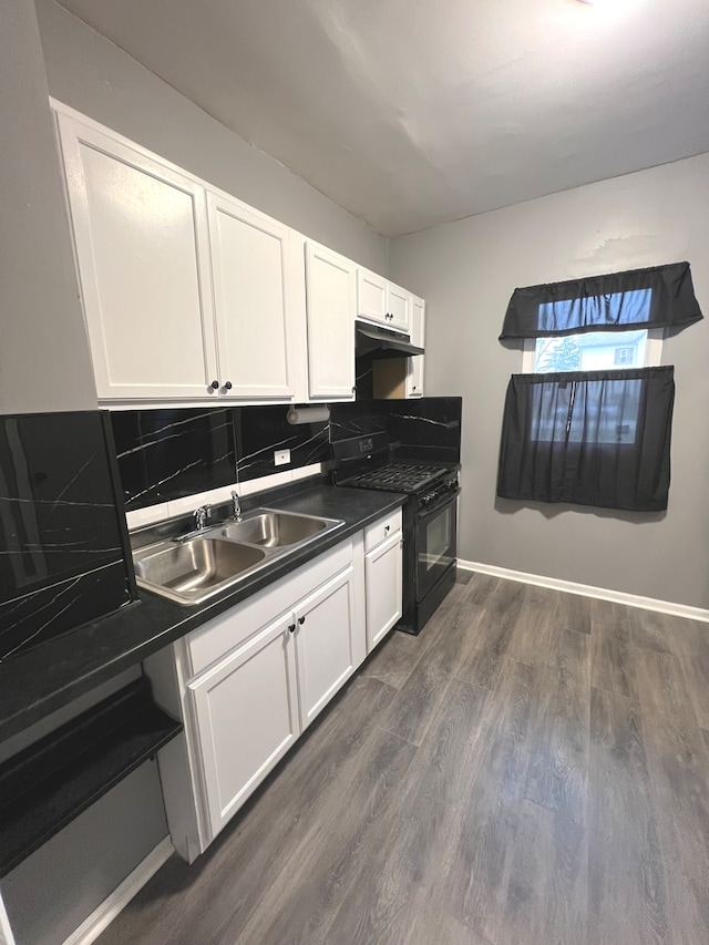 kitchen with dark hardwood / wood-style floors, black gas stove, white cabinetry, and sink