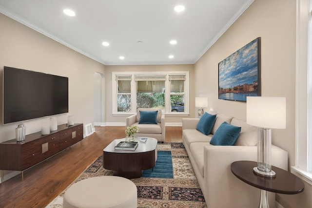 living room featuring crown molding and dark wood-type flooring