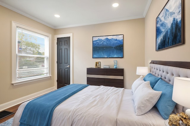 bedroom featuring hardwood / wood-style flooring and ornamental molding