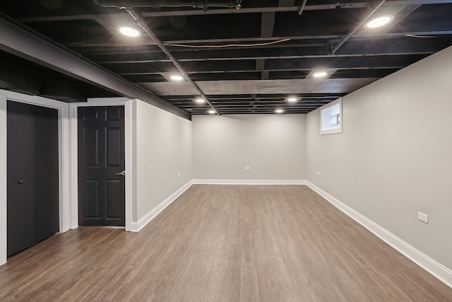 basement featuring hardwood / wood-style flooring