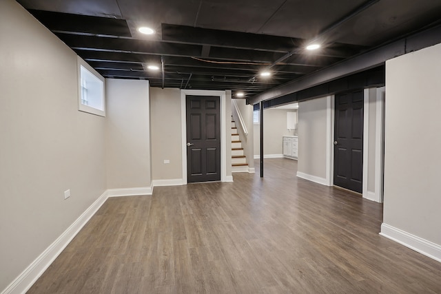 basement with hardwood / wood-style flooring