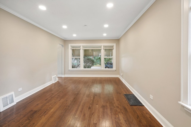 spare room with hardwood / wood-style floors and ornamental molding