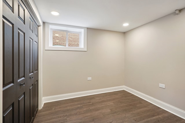 unfurnished room featuring dark wood-type flooring