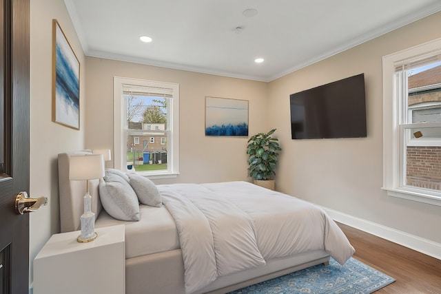 bedroom featuring wood-type flooring and ornamental molding