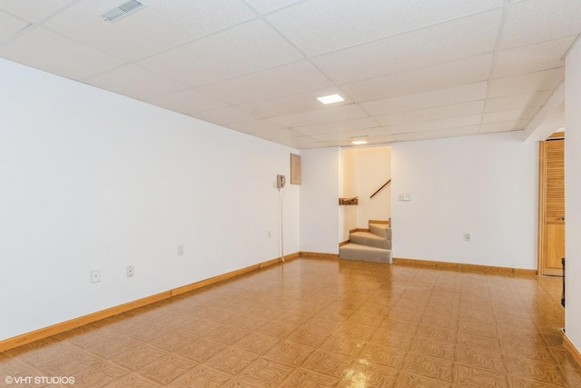 13482 S Silverleaf Rd, Plainfield, IL 60544 - spare room featuring stairway, a drop ceiling, and baseboards