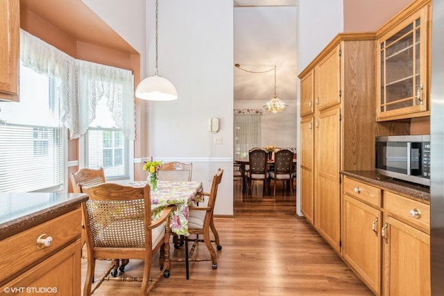 13482 S Silverleaf Rd, Plainfield, IL 60544 - dining space featuring light wood-style floors, a chandelier, and lofted ceiling