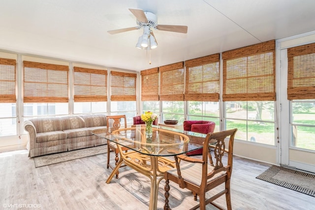 13482 S Silverleaf Rd, Plainfield, IL 60544 - sunroom featuring wood finished floors, a ceiling fan, outdoor dining area, and outdoor lounge area