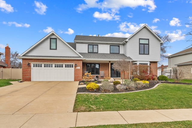 front of property featuring a front lawn and a garage