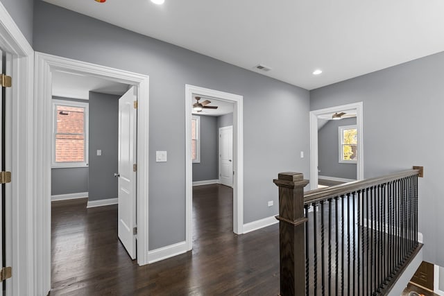 hall with dark hardwood / wood-style flooring