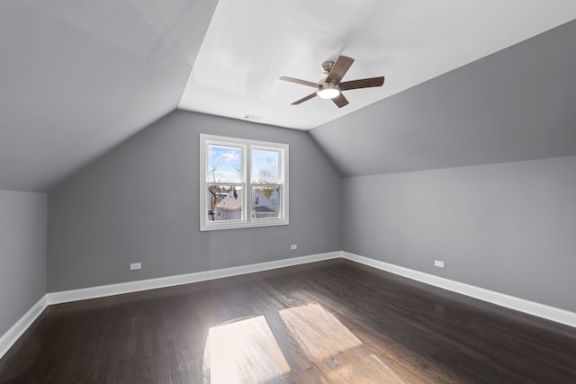 bonus room with vaulted ceiling, ceiling fan, and dark hardwood / wood-style floors