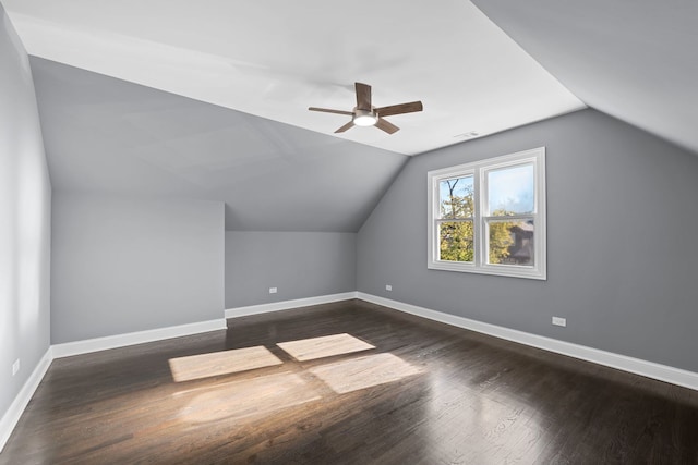 additional living space with dark hardwood / wood-style floors, ceiling fan, and lofted ceiling