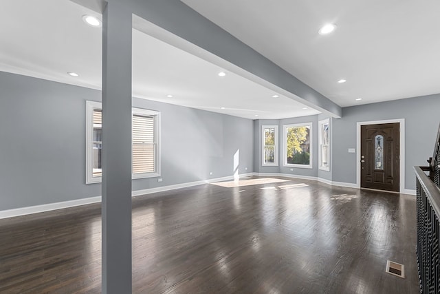 unfurnished living room with dark hardwood / wood-style floors