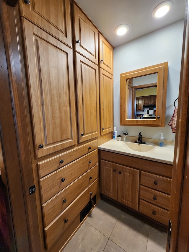 bathroom featuring tile patterned floors and vanity