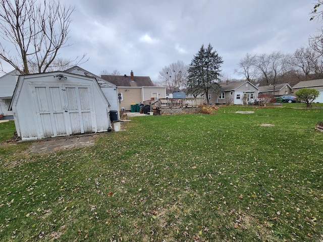 view of yard featuring a shed and a deck