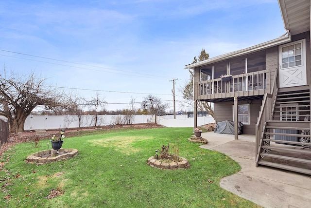 view of yard with a patio area and a sunroom