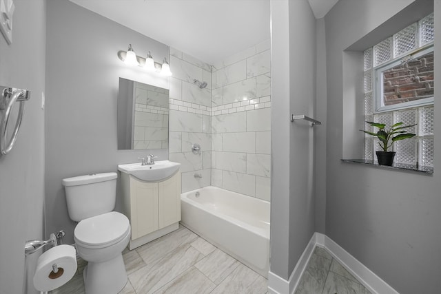 full bathroom featuring vanity, toilet, and tiled shower / bath combo