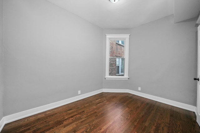 empty room with hardwood / wood-style floors