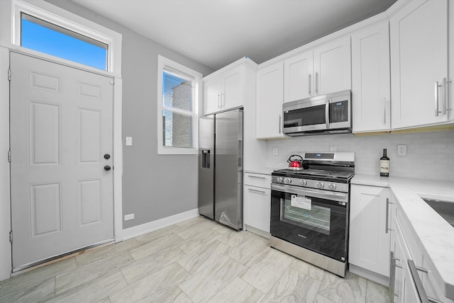 kitchen with white cabinetry and stainless steel appliances