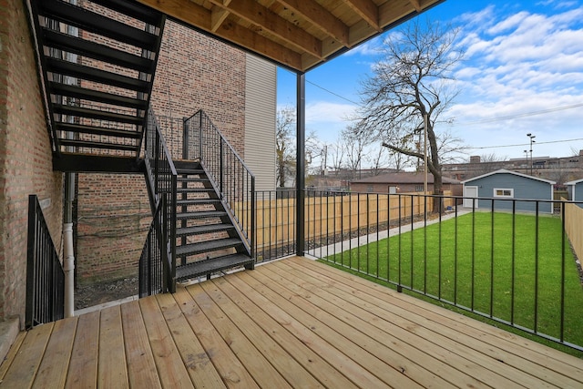 wooden deck with a lawn