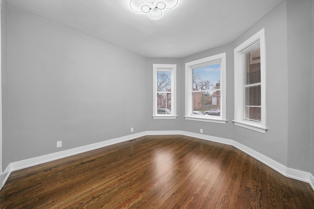 spare room featuring hardwood / wood-style flooring