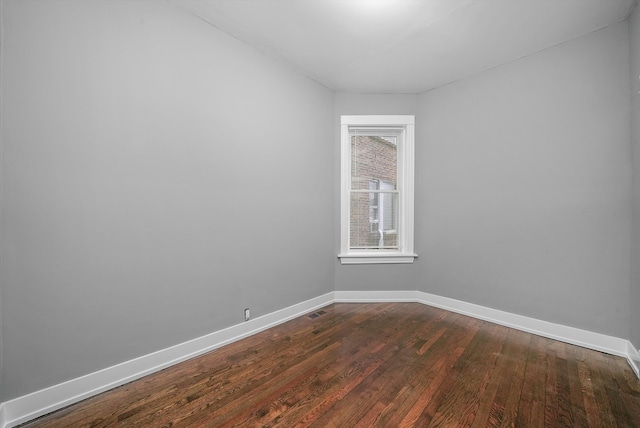 spare room with hardwood / wood-style flooring