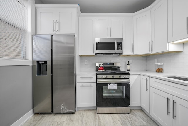 kitchen with white cabinets and stainless steel appliances