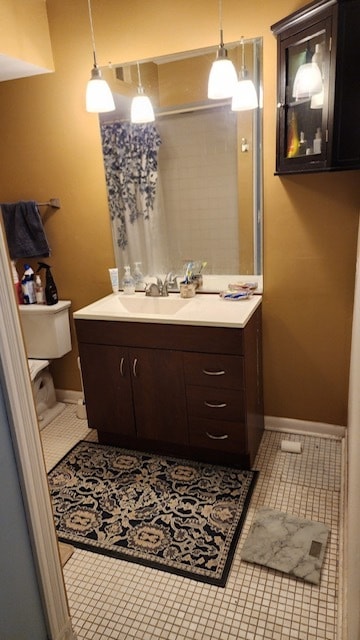 bathroom featuring tile patterned flooring and vanity